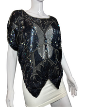 Load image into Gallery viewer, Mannequin wearing a black sequined top with butterfly designs on a plain background
