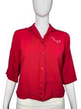 Load image into Gallery viewer, Red shirt on a mannequin with &#39;Myrt&#39; embroidery against a neutral background
