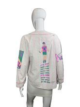 Load image into Gallery viewer, Striped shirt with colorful designs and text on a mannequin against a white background
