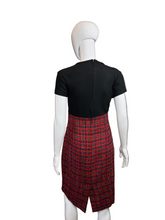 Load image into Gallery viewer, Mannequin wearing a black top and red plaid skirt 
