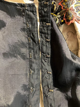 Load image into Gallery viewer, Hook and eye closure up the side of a black satin garment. 
