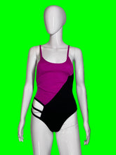 Load image into Gallery viewer, A color-blocked one-piece swimsuit in magenta pink and black, displayed on a white mannequin.
