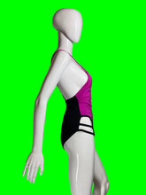 Load image into Gallery viewer, A white mannequin torso wearing a one-piece swimsuit with a bright pink upper section and black lower section with white side stripes.
