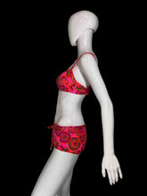 Load image into Gallery viewer, A two-piece bikini swimsuit with a vibrant pink, red, and green paisley pattern, displayed on a white mannequin.
