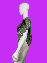 Load image into Gallery viewer, A sleeveless black and silver sequined top displayed on a white mannequin torso.
