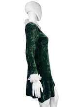 Load image into Gallery viewer, Green velvet dress on a mannequin.
