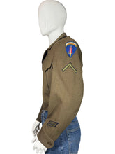 Load image into Gallery viewer, Green WWII army jacket and blue jeans on a mannequin against a plain background
