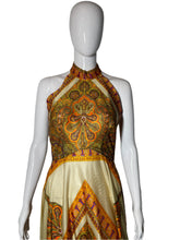 Load image into Gallery viewer, Decorative garment on a mannequin with intricate patterns on a plain background
