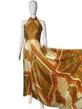 Load image into Gallery viewer, Mannequin wearing a patterned dress with intricate designs on a plain background
