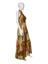 Load image into Gallery viewer, Mannequin wearing a patterned dress against a white wall.
