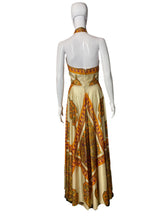 Load image into Gallery viewer, Mannequin wearing a patterned dress with a plain background
