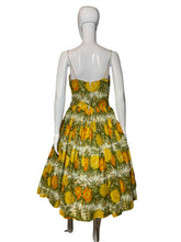 Load image into Gallery viewer, Mannequin wearing a yellow floral dress against a plain background

