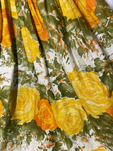 Load image into Gallery viewer, Floral patterned fabric with yellow roses and green leaves on a white background
