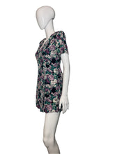 Load image into Gallery viewer, Mannequin wearing a floral romper on a plain background
