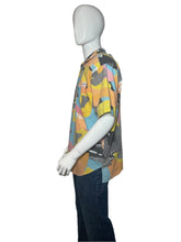 Load image into Gallery viewer, Mannequin wearing a colorful patterned garment on a plain background
