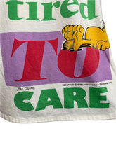 Load image into Gallery viewer, Towel with Garfield cartoon character and colorful text on a white background
