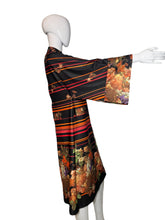 Load image into Gallery viewer, Mannequin wearing a colorful dress with floral patterns on a white background
