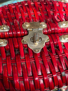 Close-up of a red woven basket with metal clasps