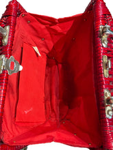 Load image into Gallery viewer, Red handbag with a metallic handle and latches, open to reveal red interior.
