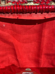 Close-up of a red lining detached from outer shell